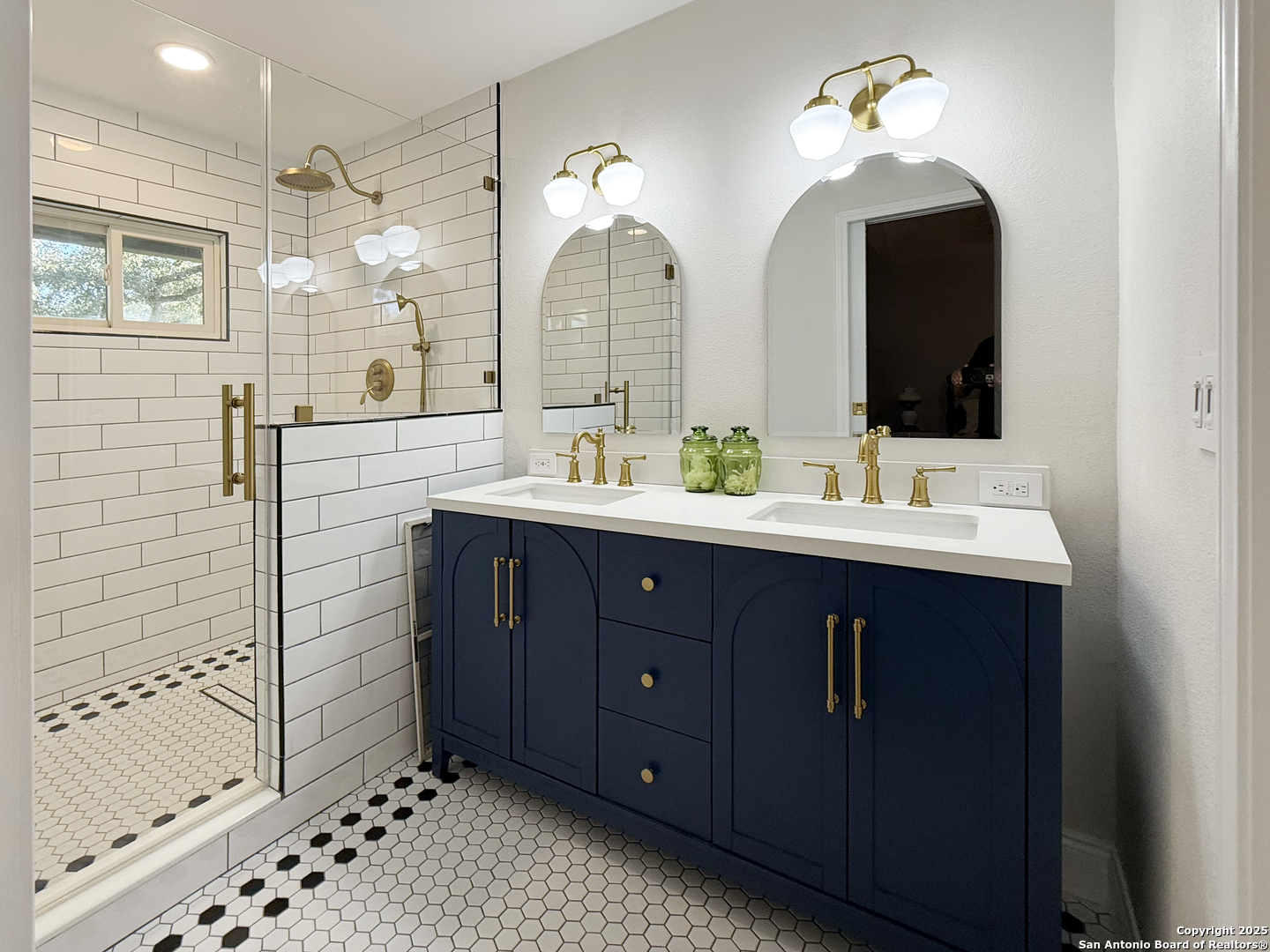12518 Chateau Forest Lane San Antonio, TX 78230 - Photo 33 of 37 a bathroom with a double vanity sink mirror and shower