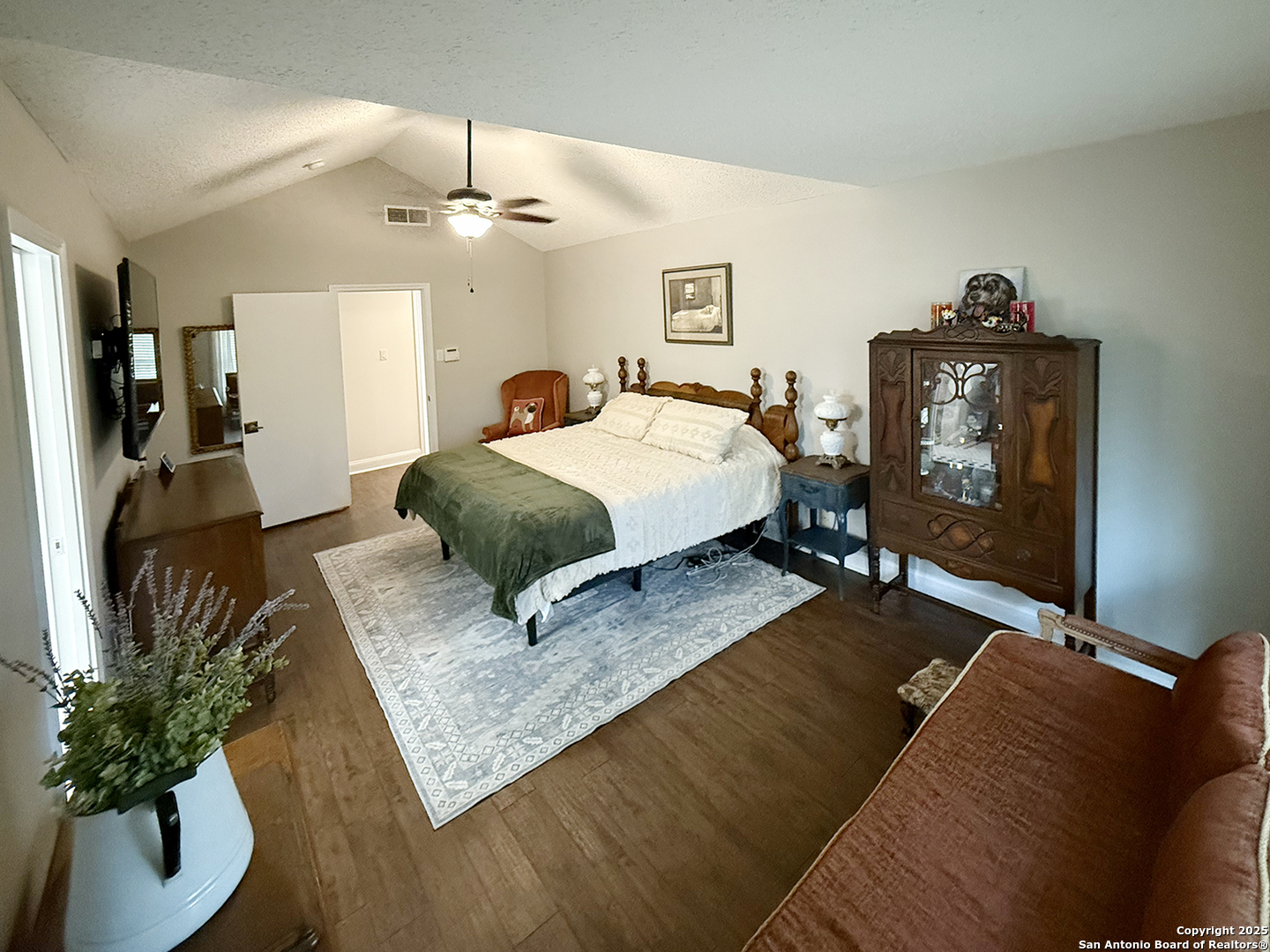 12518 Chateau Forest Lane San Antonio, TX 78230 - Photo 34 of 37 a living room with furniture and a chandelier