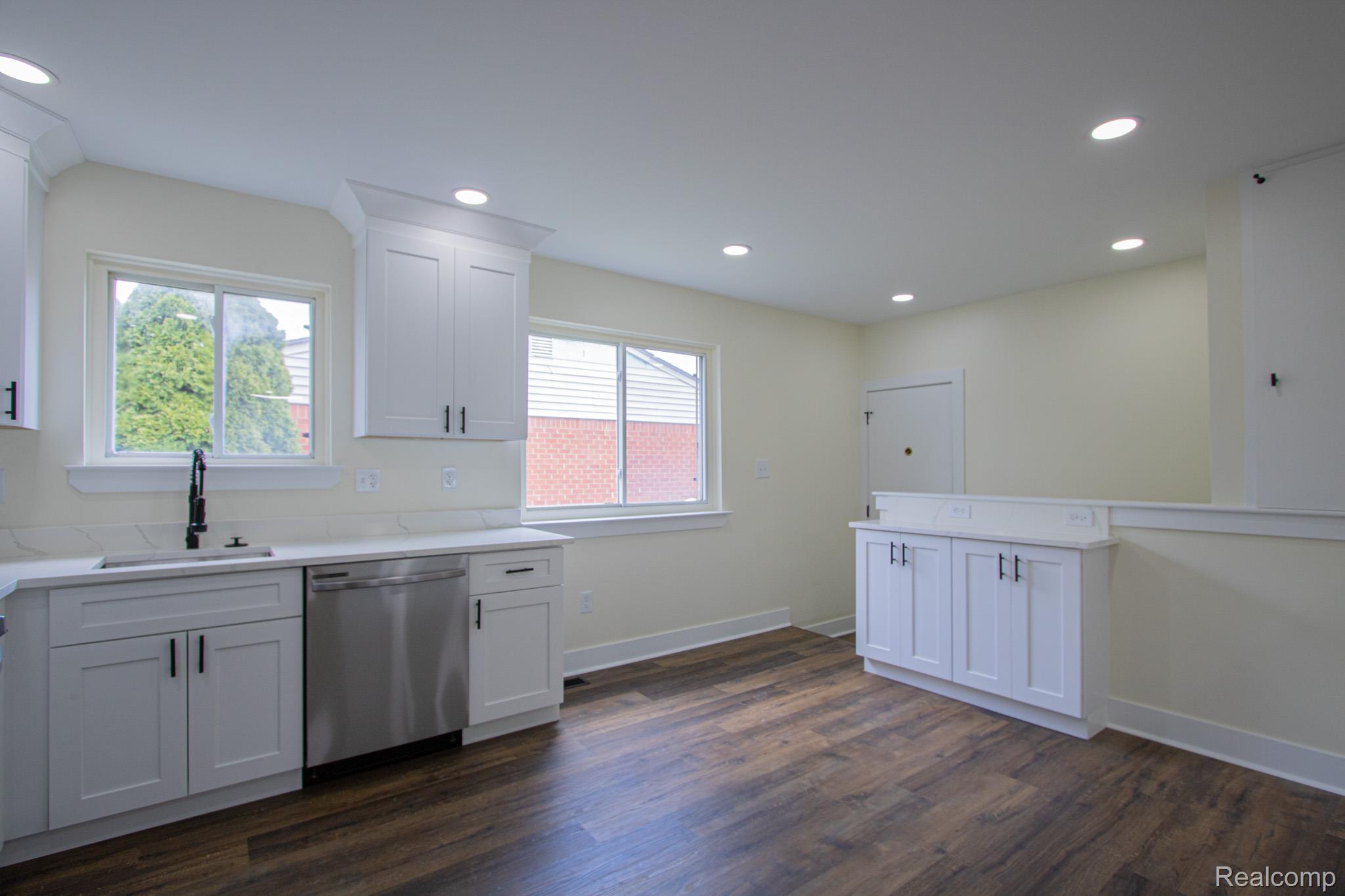 31000 Fall Fraser, MI 48026 - Photo 9 of 28 Kitchen with white cabinetry, recessed lighting, dark wood-style floors, and stainless steel dishwasher