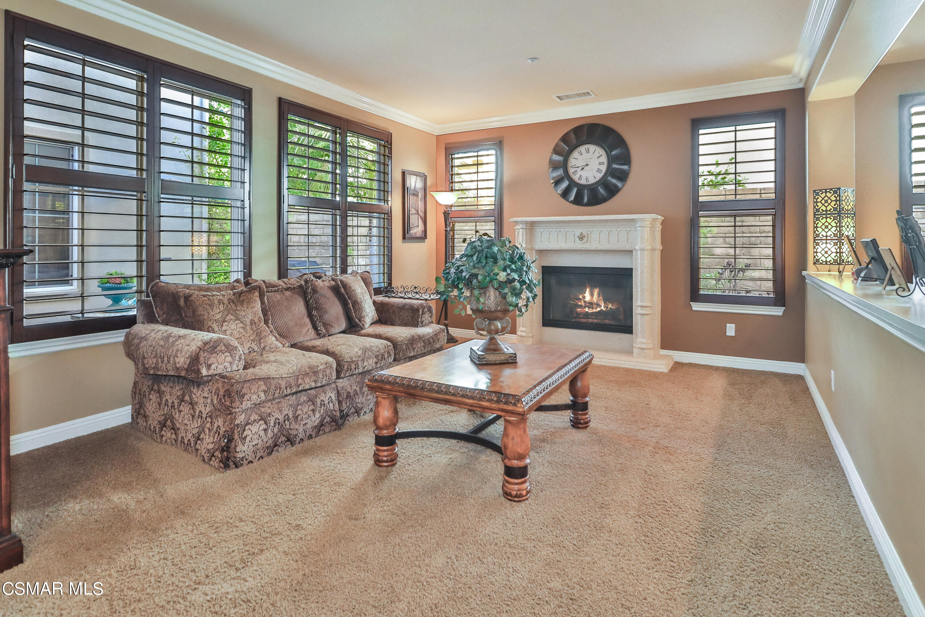 4025 Eagle Flight Drive Simi Valley, CA 93065 - Photo 19 of 60 a living room with furniture a fireplace and a large window