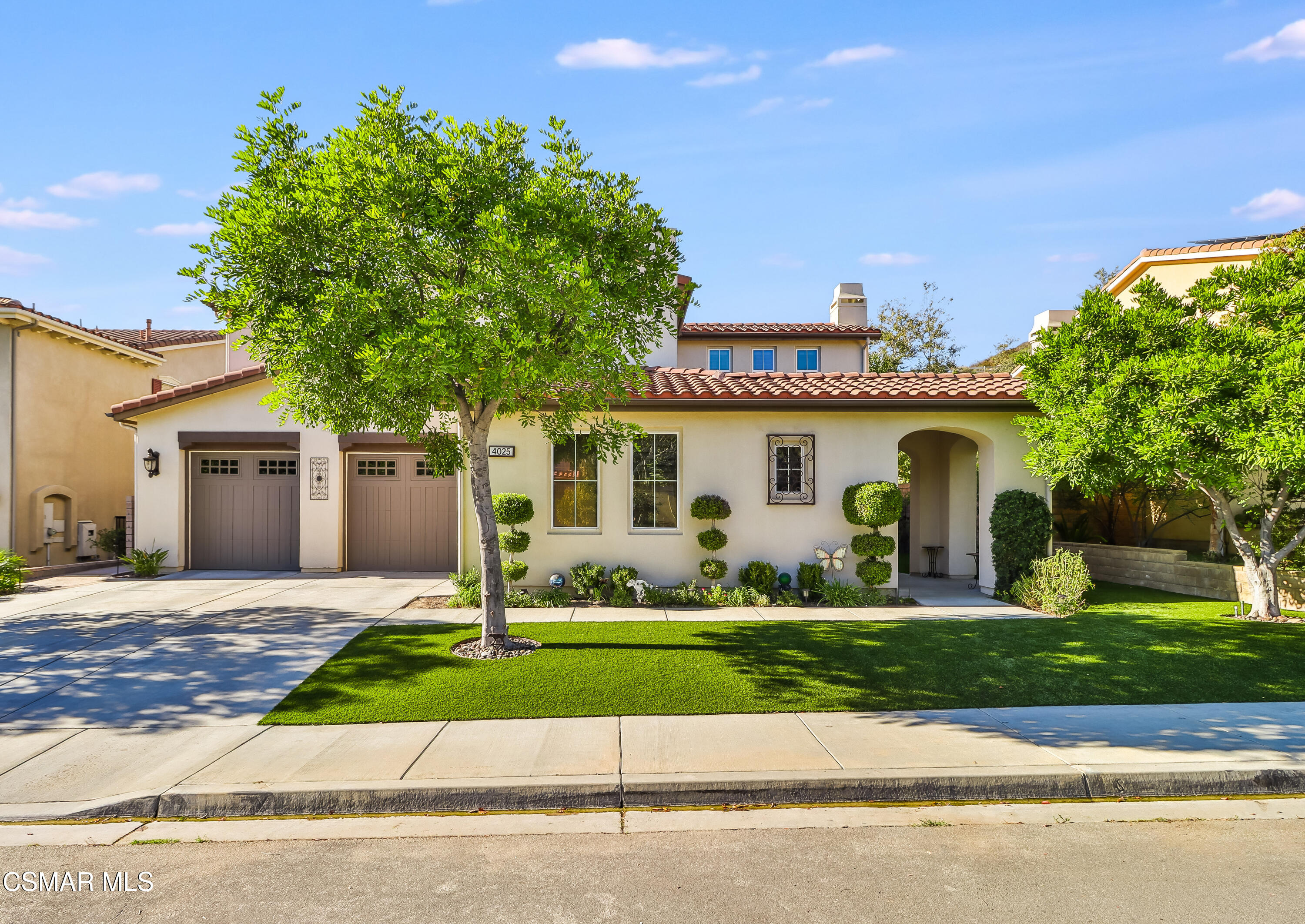 4025 Eagle Flight Drive Simi Valley, CA 93065 - Photo 2 of 60 a front view of a house with a yard and garage