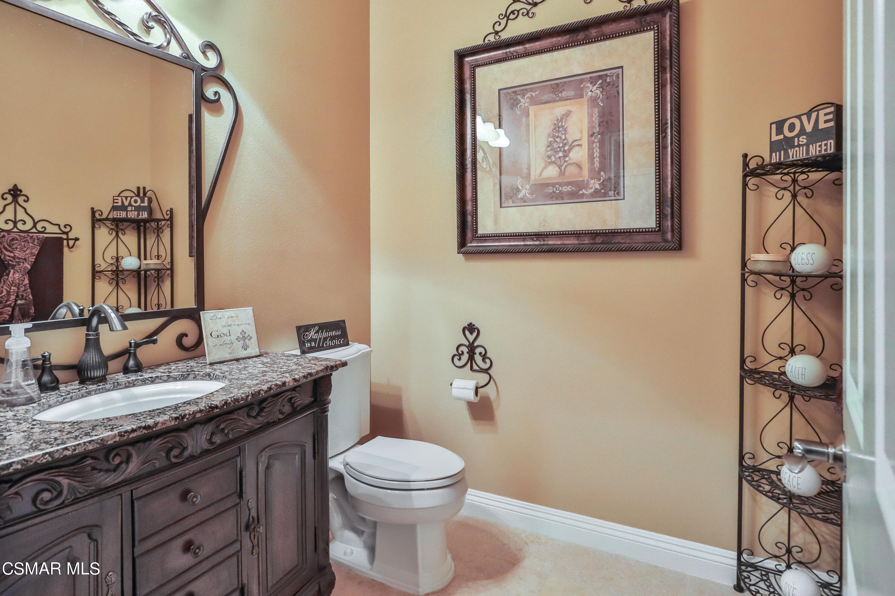 4025 Eagle Flight Drive Simi Valley, CA 93065 - Photo 26 of 60 a bathroom with a granite countertop sink a toilet and a mirror