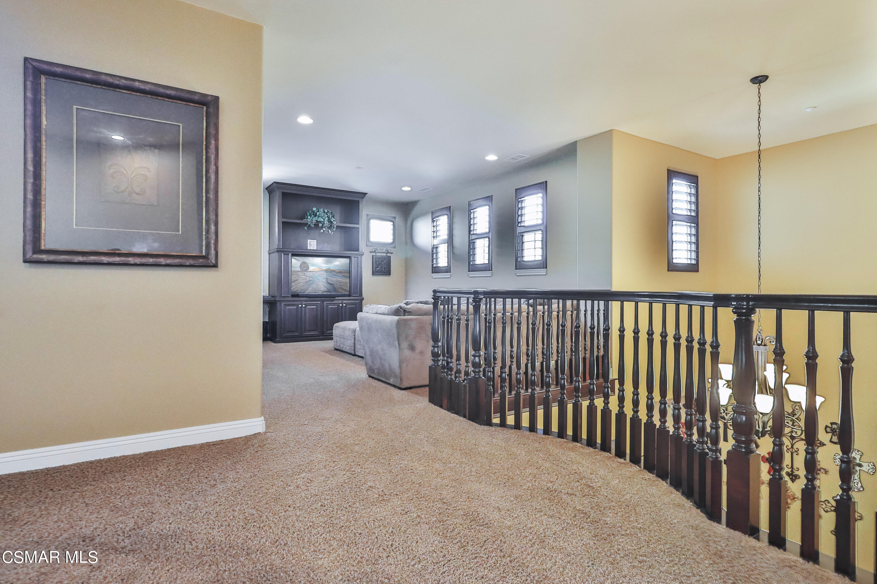 4025 Eagle Flight Drive Simi Valley, CA 93065 - Photo 31 of 60 a view of a hallway to a livingroom with furniture and windows