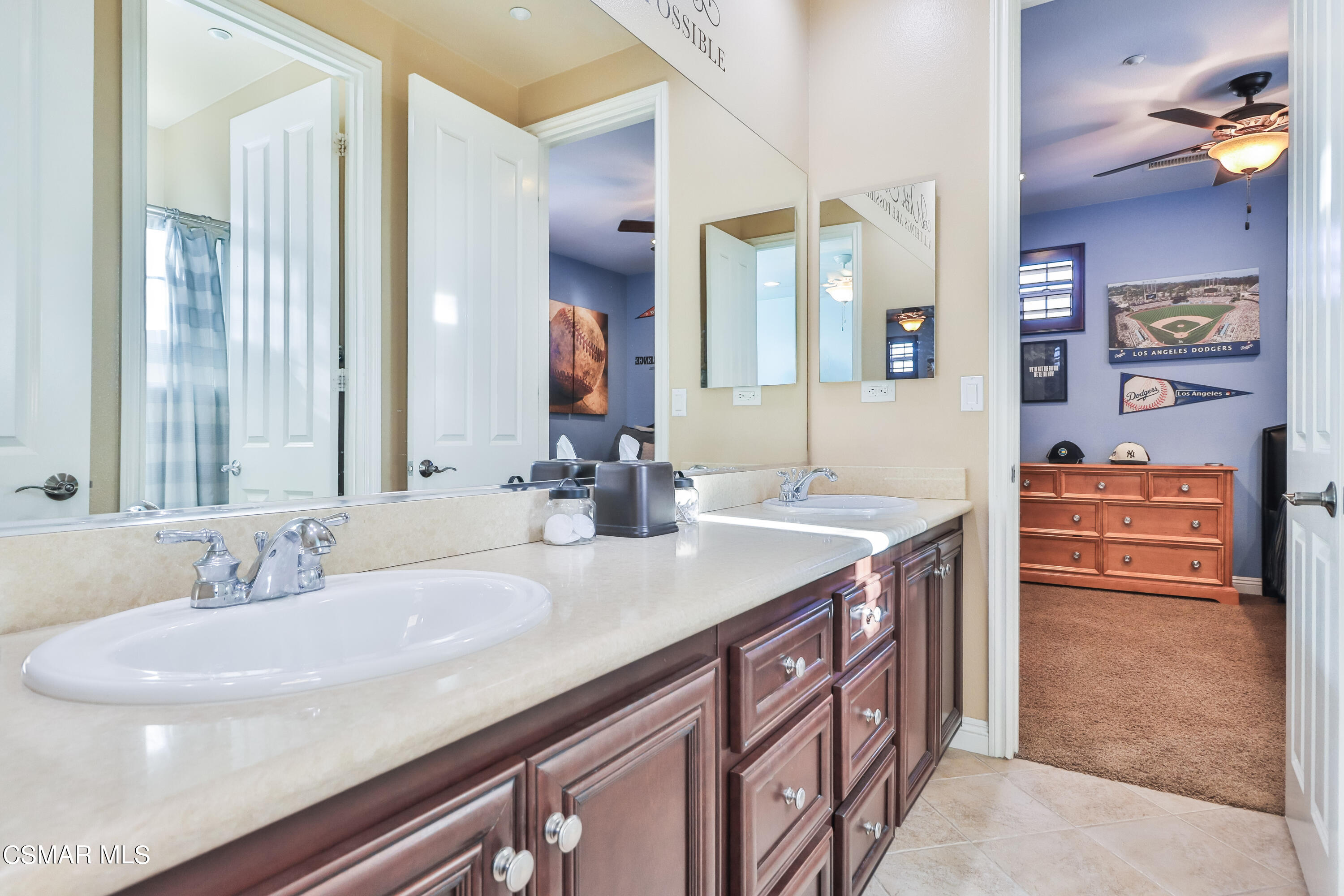 4025 Eagle Flight Drive Simi Valley, CA 93065 - Photo 42 of 60 a bathroom with a sink and a mirror