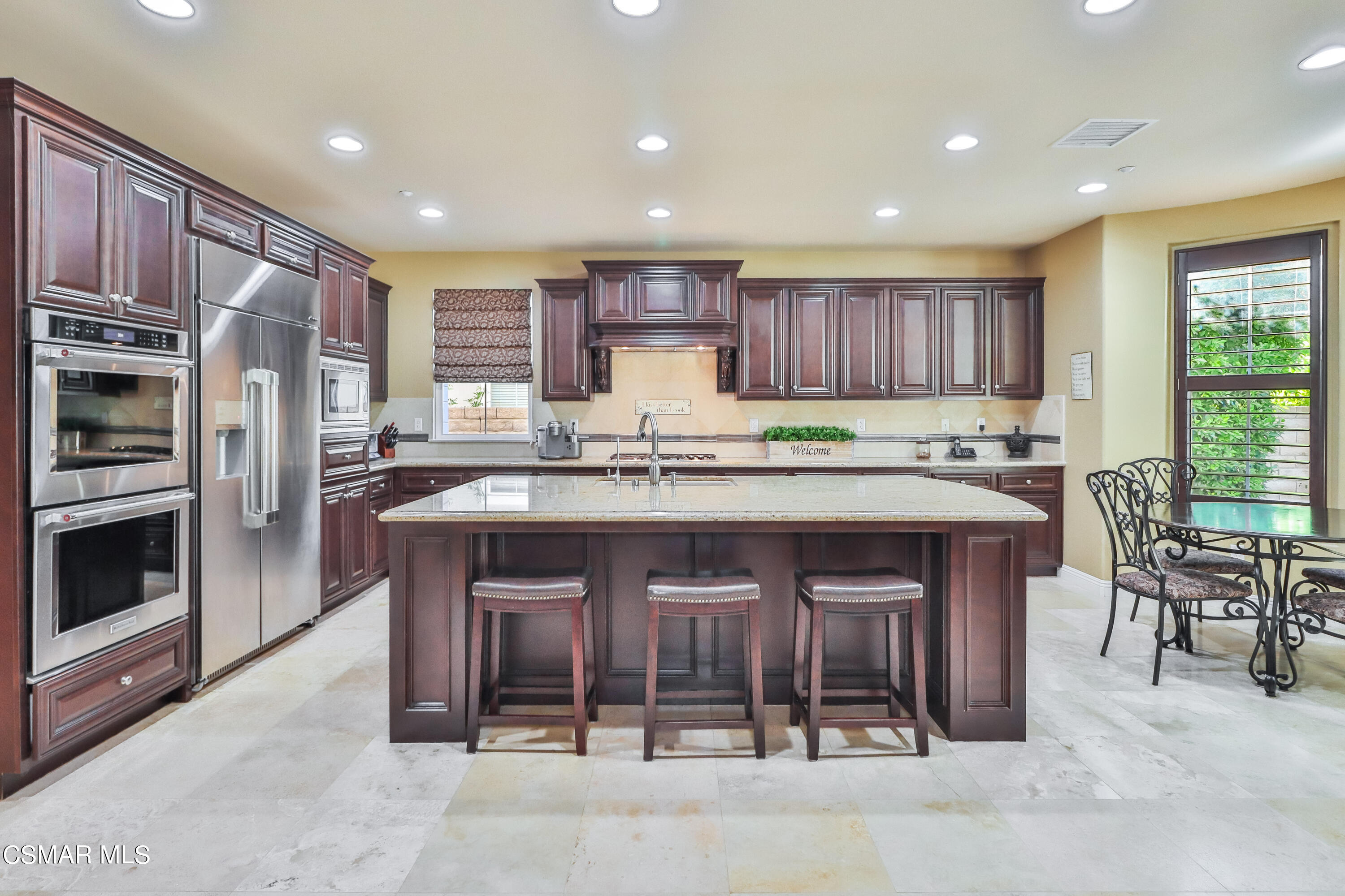 4025 Eagle Flight Drive Simi Valley, CA 93065 - Photo 9 of 60 a kitchen with stainless steel appliances granite countertop a stove refrigerator and a sink