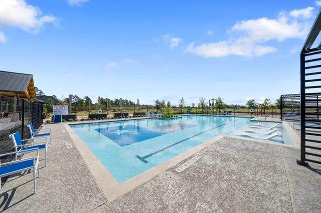 a view of swimming pool with a yard