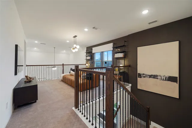 a view of a hallway with seating area