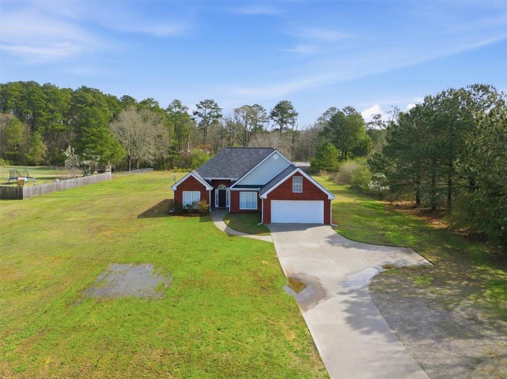 493 Youth Jersey Road Covington, GA 30014 - Photo 44 of 52 a view of a house with a big yard