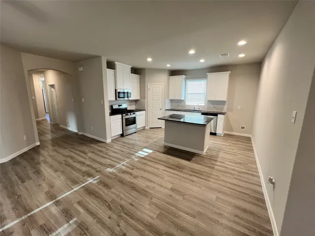 a view of kitchen with wooden floor