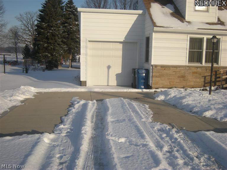 38174 Sugar Ridge Road North Ridgeville, OH 44039 - Photo 17 of 21 New double wide concrete driveway and turn-around installed in 2011! Garage is also new in 2011.