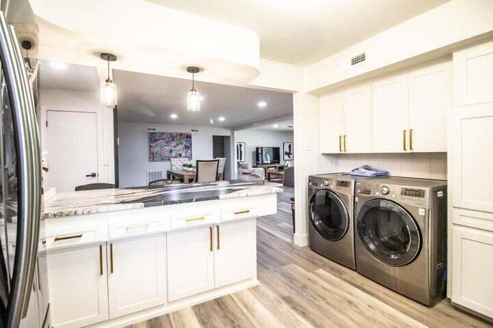 3501 33rd Street Lubbock, TX 79410 - Photo 13 of 34 a view of a kitchen with stainless steel appliances kitchen island granite countertop a sink and cabinets
