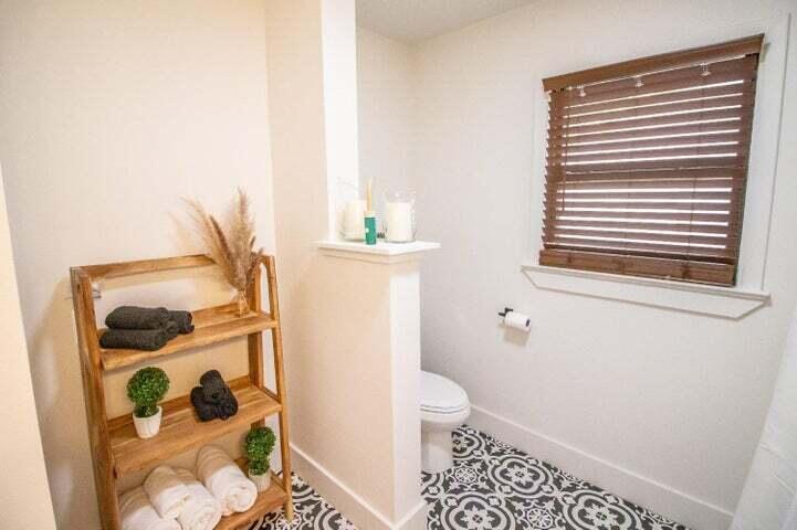 3501 33rd Street Lubbock, TX 79410 - Photo 23 of 34 a bathroom with a toilet and a shower curtain