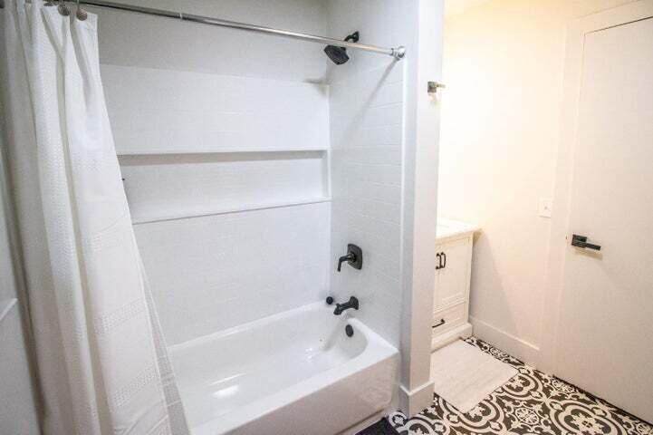 3501 33rd Street Lubbock, TX 79410 - Photo 24 of 34 a bathroom with a bathtub and a shower