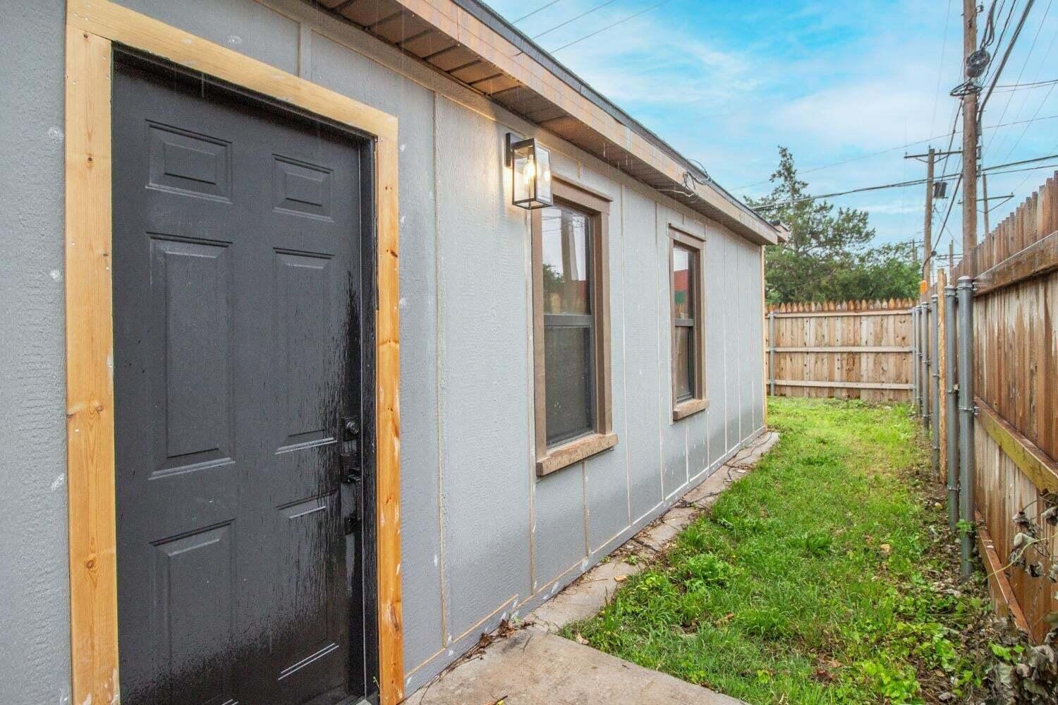 3501 33rd Street Lubbock, TX 79410 - Photo 27 of 34 a backyard of a house with outdoor seating and plants