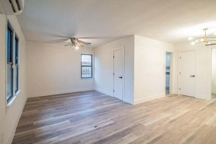 3501 33rd Street Lubbock, TX 79410 - Photo 28 of 34 wooden floor in an empty room with a window