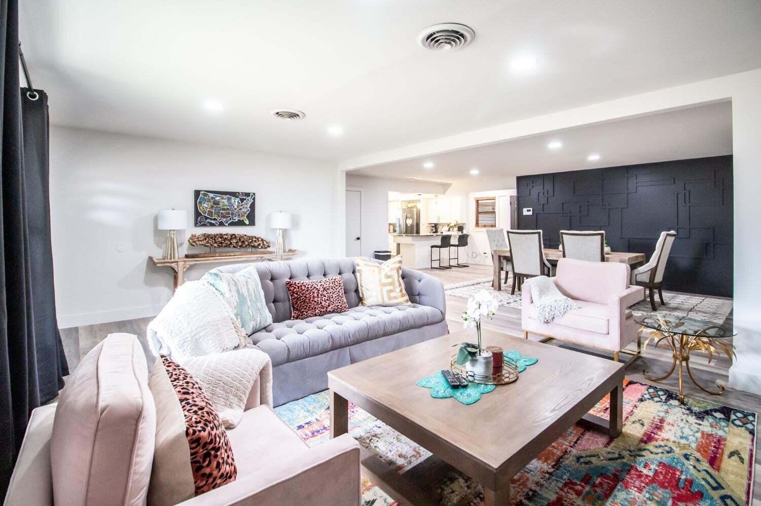 3501 33rd Street Lubbock, TX 79410 - Photo 3 of 34 a living room with furniture and a dining table with kitchen view