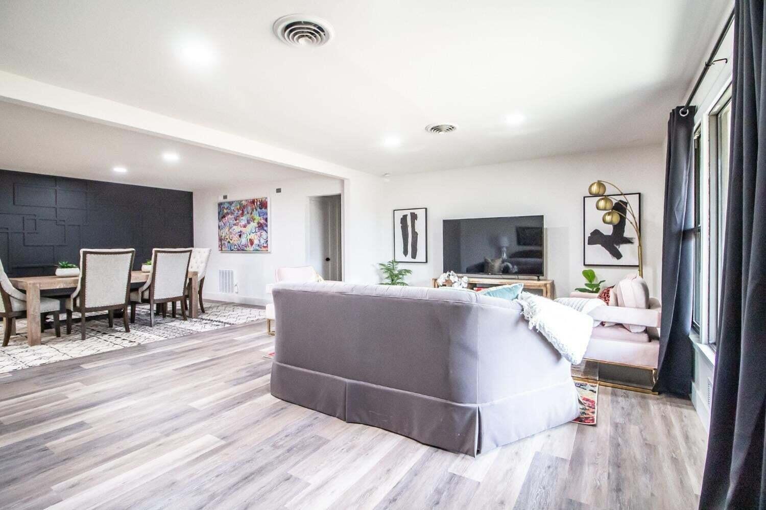 3501 33rd Street Lubbock, TX 79410 - Photo 5 of 34 a living room with furniture and a flat screen tv