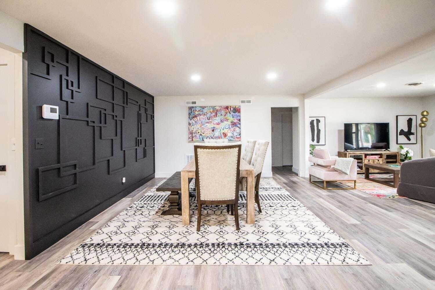 3501 33rd Street Lubbock, TX 79410 - Photo 7 of 34 a living room with furniture a rug and a table