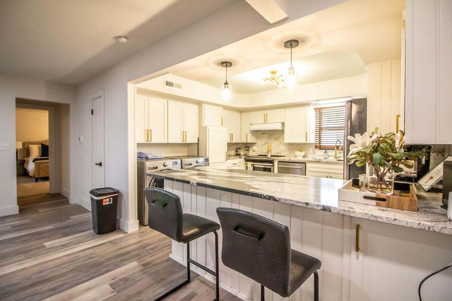 3501 33rd Street Lubbock, TX 79410 - Photo 9 of 34 a kitchen with a sink cabinets and window