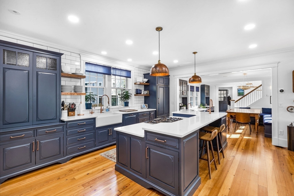 1 R Bailey's Island Road Scituate, MA 02066 - Photo 15 of 42 a kitchen with stainless steel appliances granite countertop a sink a stove and a wooden floors