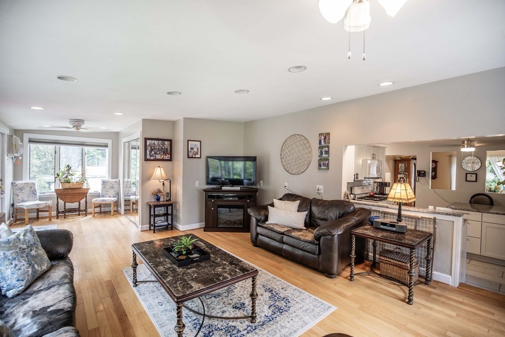 96 Wyman Road Billerica, MA 01821 - Photo 19 of 35 a living room with furniture fireplace and a table