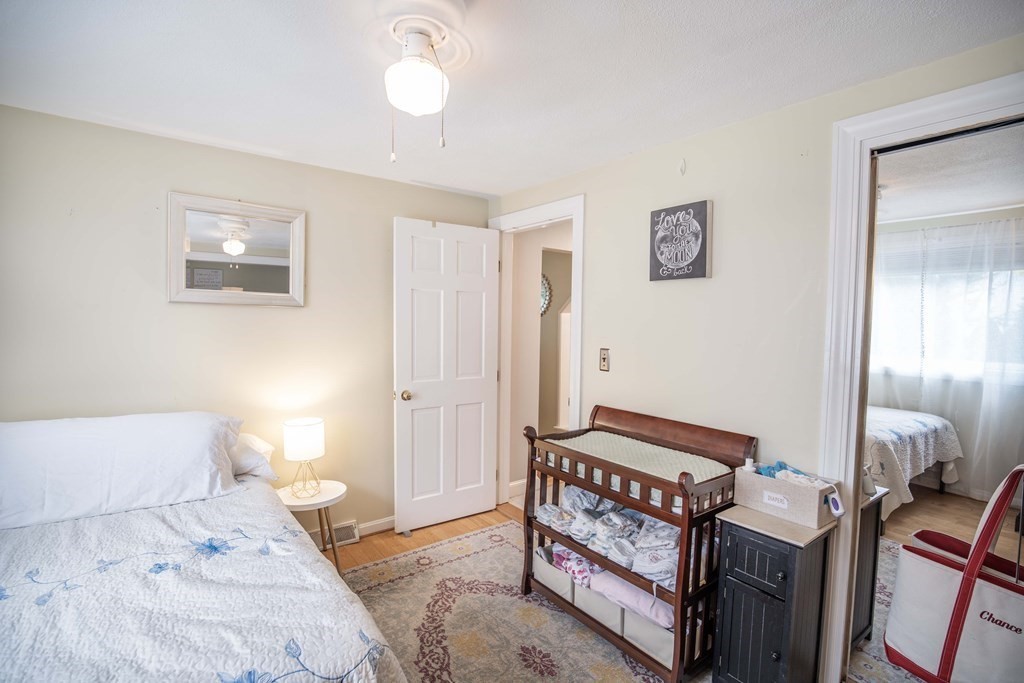 96 Wyman Road Billerica, MA 01821 - Photo 24 of 35 a bedroom with furniture and a window