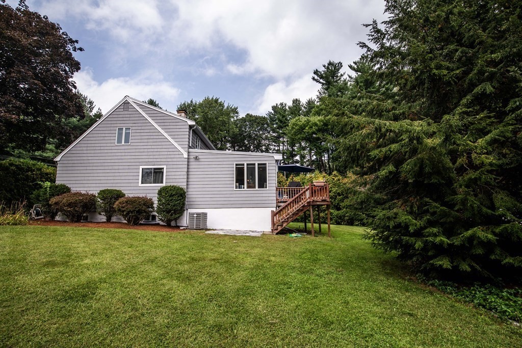 96 Wyman Road Billerica, MA 01821 - Photo 4 of 35 a view of a house with a yard and garden