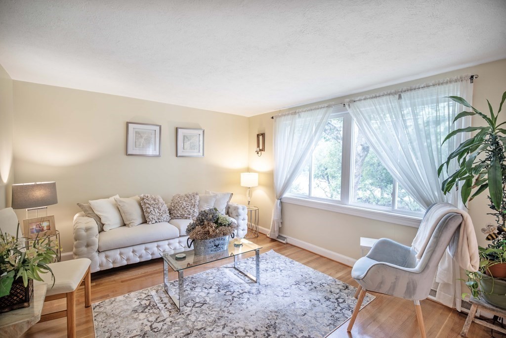 96 Wyman Road Billerica, MA 01821 - Photo 5 of 35 a living room with furniture and a large window