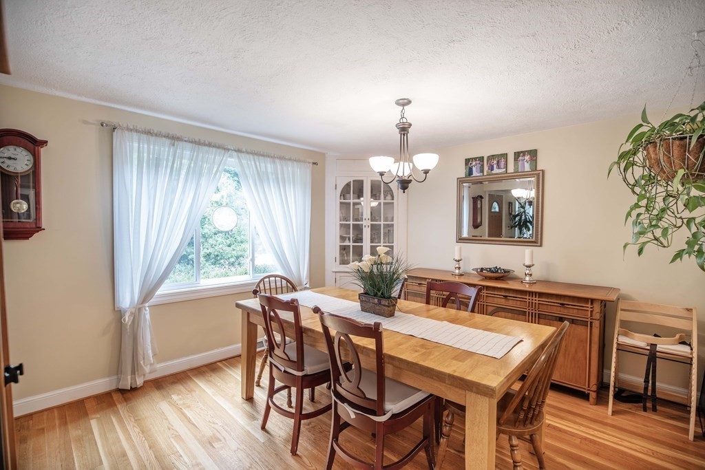 96 Wyman Road Billerica, MA 01821 - Photo 9 of 35 a view of a dining room with furniture window and wooden floor