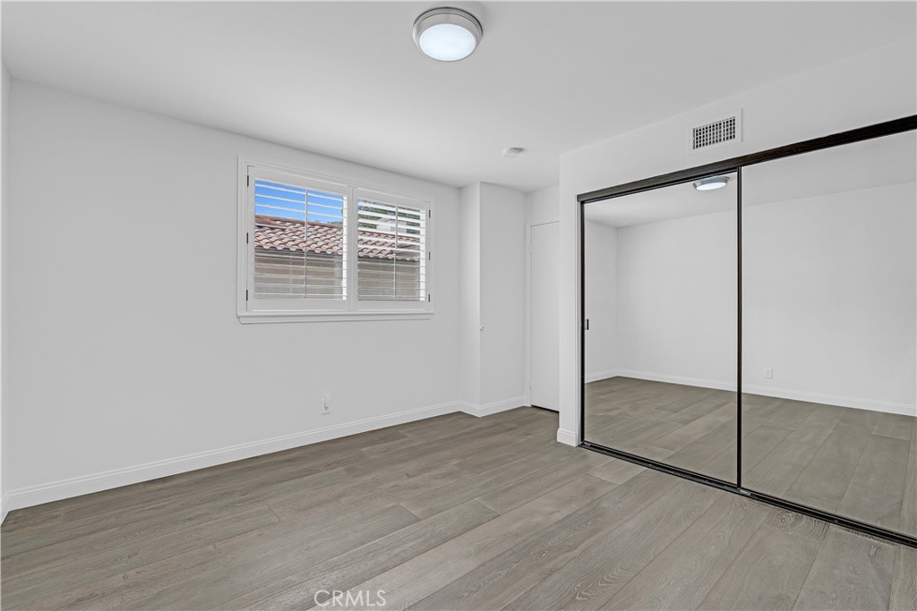 19451 Eagle Ridge Lane Porter Ranch, CA 91326 - Photo 41 of 59 an empty room with wooden floor and windows