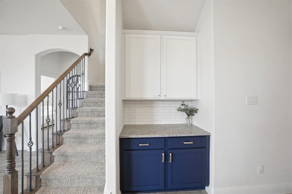 2909 Faro Road Aubrey, TX 76227 - Photo 11 of 32 a bathroom with a sink and a bathtub