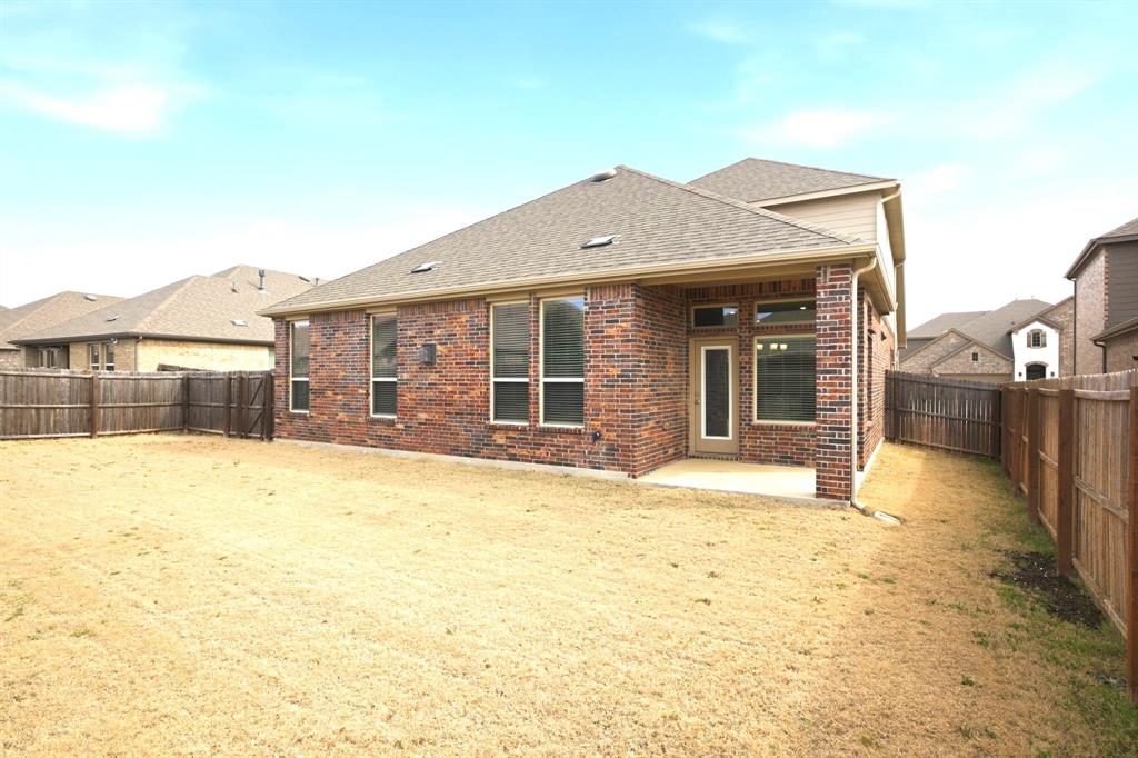 2909 Faro Road Aubrey, TX 76227 - Photo 23 of 32 a view of a house with a swimming pool