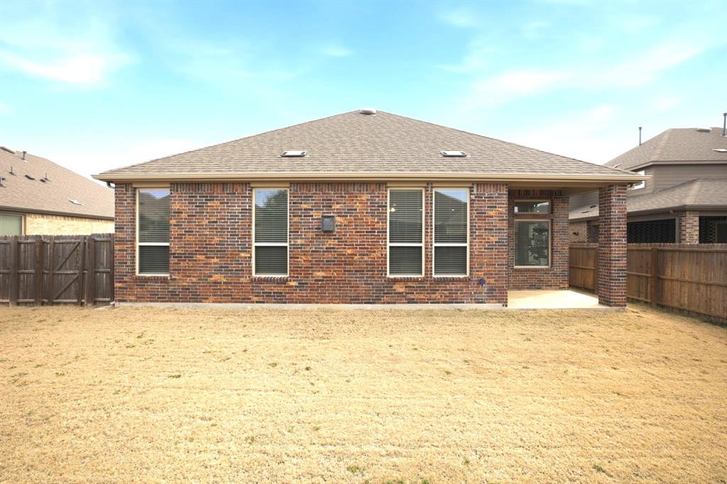 2909 Faro Road Aubrey, TX 76227 - Photo 24 of 32 a front view of a house with a yard