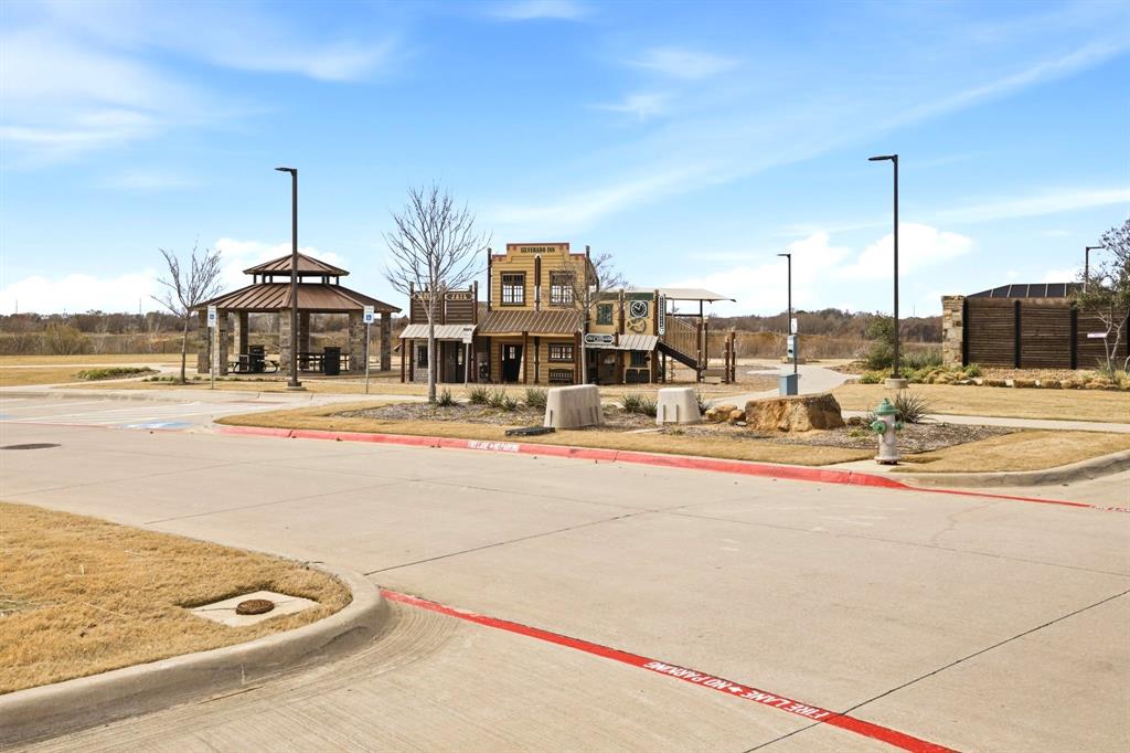 2909 Faro Road Aubrey, TX 76227 - Photo 27 of 32 a view of a building with a ocean view