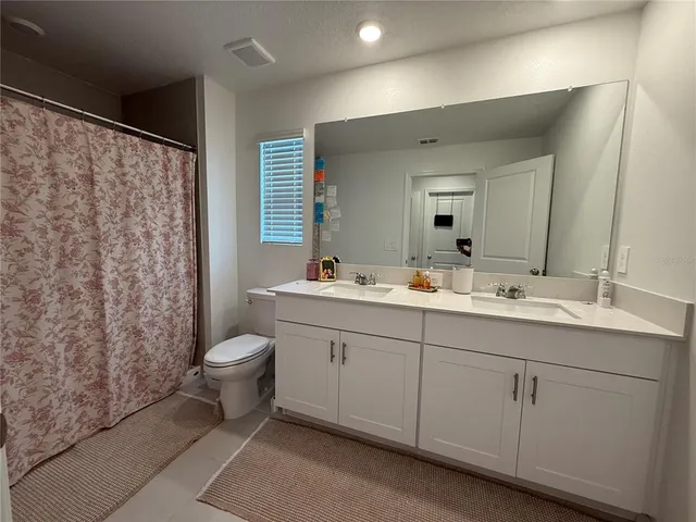 a view of a swimming pool with a table and chairs