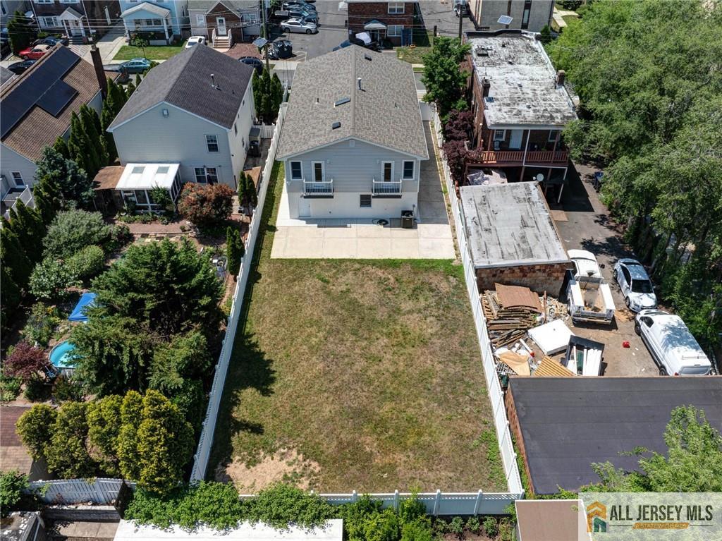 278 Rector Street Perth Amboy, NJ 08861 - Photo 44 of 47 an aerial view of a house with yard and parking