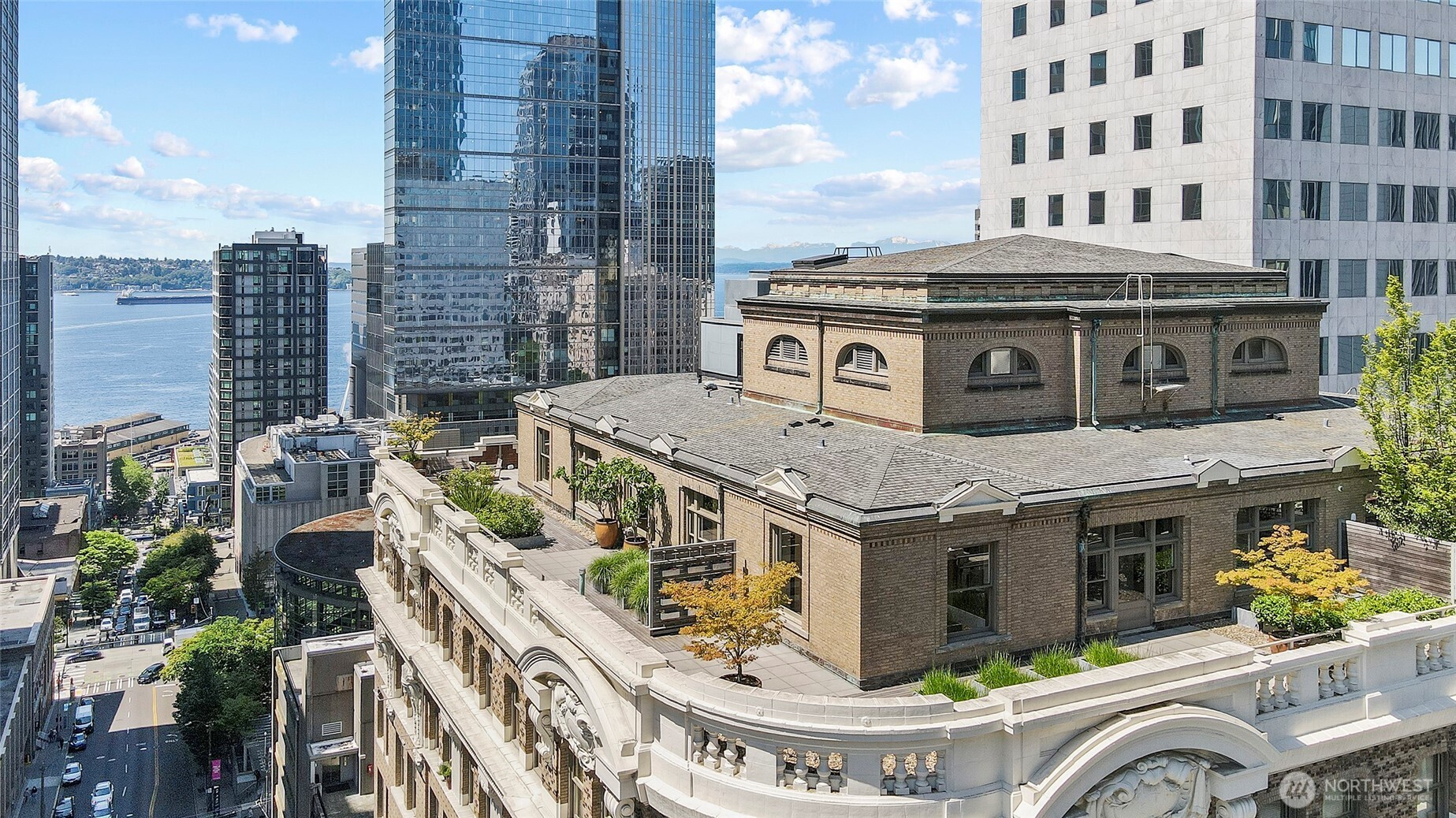 1301 4th Avenue, Unit 1101 Seattle, WA 98101 - Photo 1 of 1 a large building with a clock tower in front of it