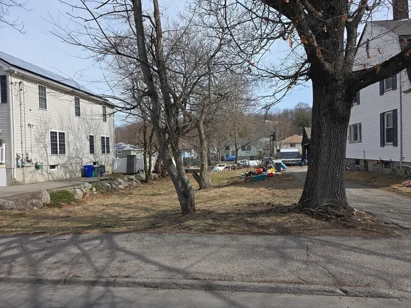 a view of street with parked cars