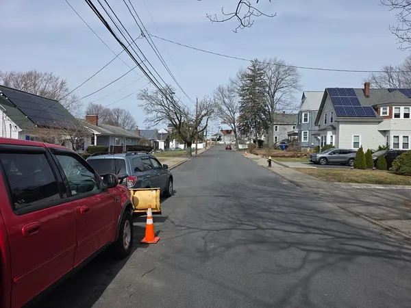 a view of a city street with tall buildings