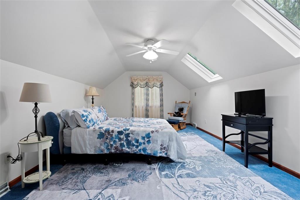 102 Foxglove Road Baden, PA 15005 - Photo 37 of 48 a bedroom with a bed and a flat screen tv