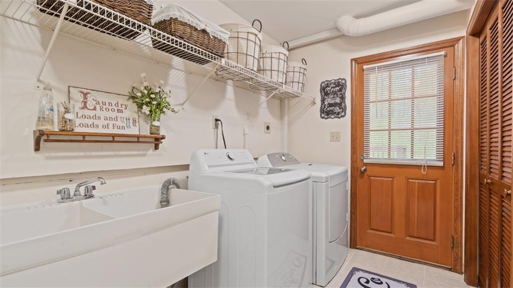 102 Foxglove Road Baden, PA 15005 - Photo 41 of 48 a bathroom with a sink and a mirror