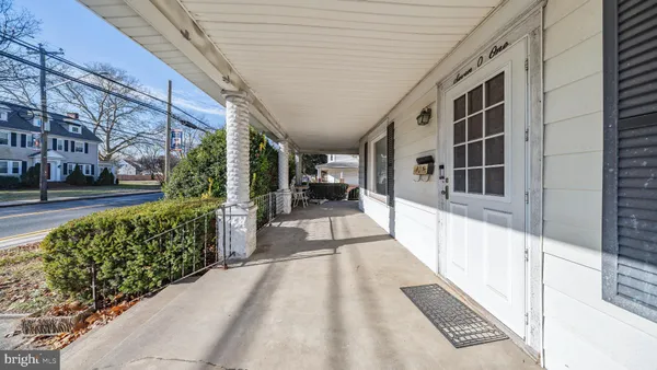 a view of a porch with seating space