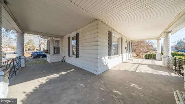 a living room with fireplace furniture and a wooden floor
