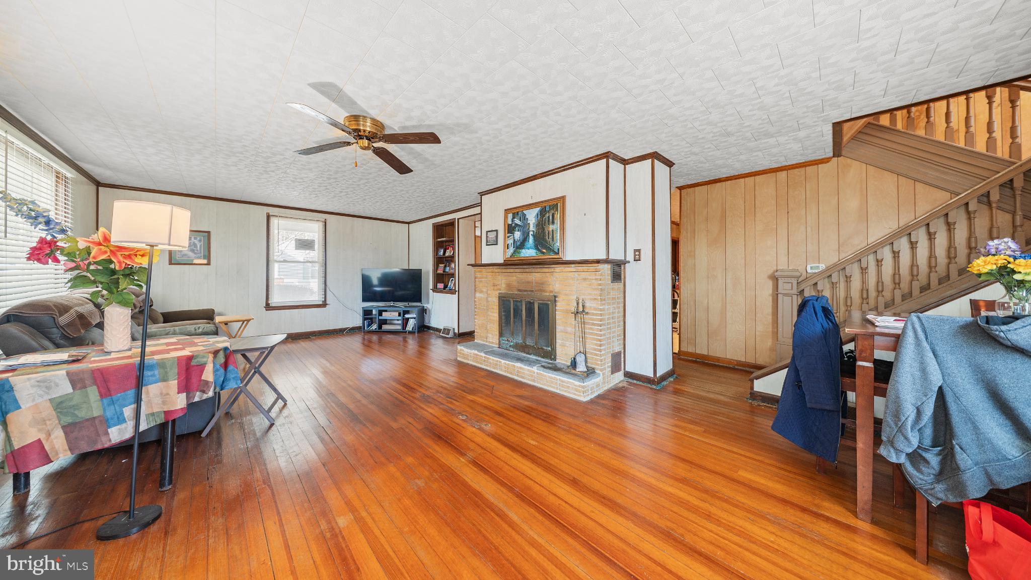 701 East State Street Delmar, DE 19940 - Photo 6 of 23 a living room with furniture and a fireplace