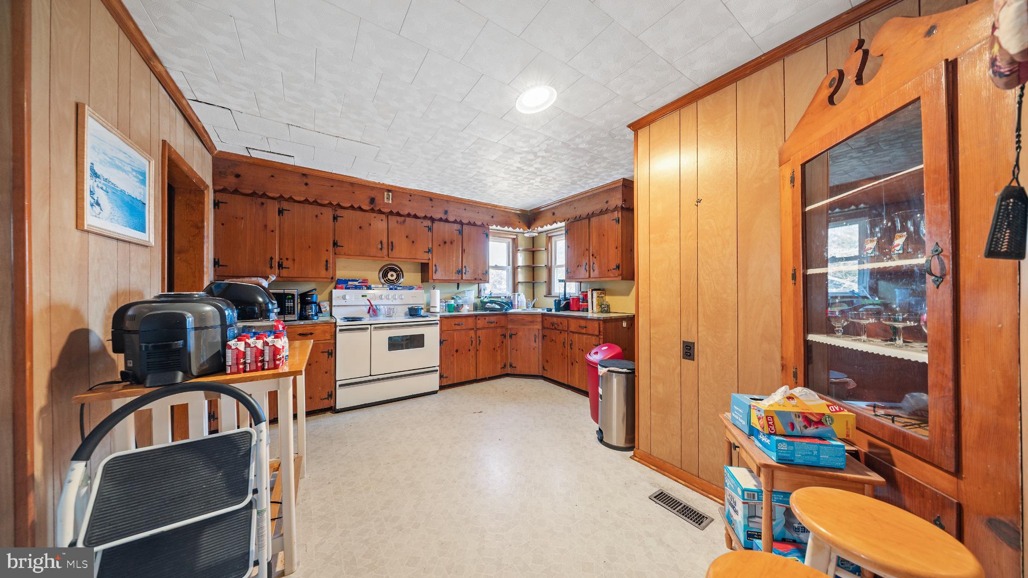 701 East State Street Delmar, DE 19940 - Photo 7 of 23 a kitchen with stainless steel appliances granite countertop a sink and cabinets