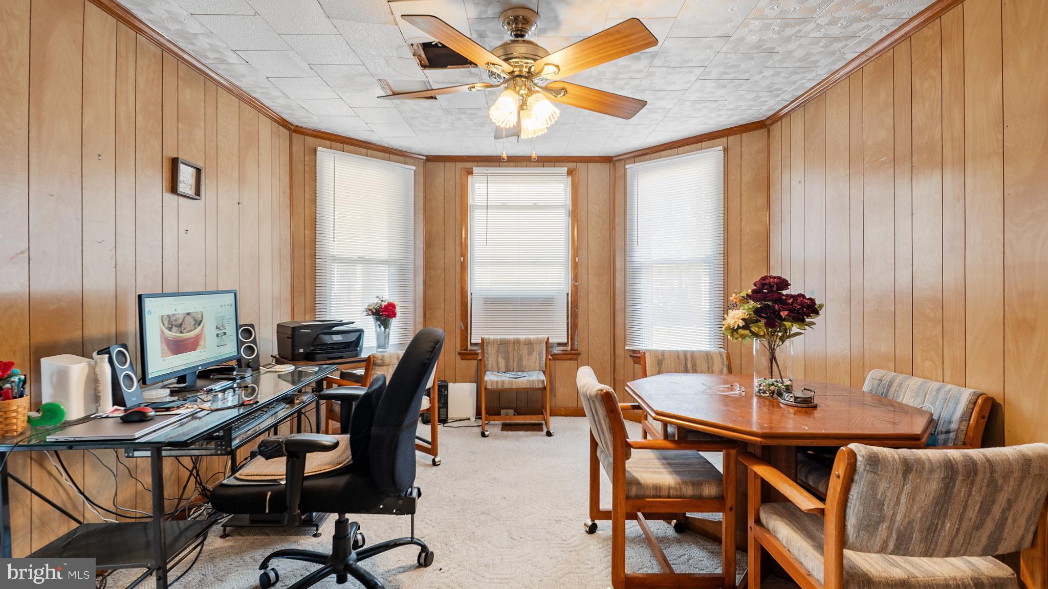 701 East State Street Delmar, DE 19940 - Photo 8 of 23 a dining room with furniture and a chandelier