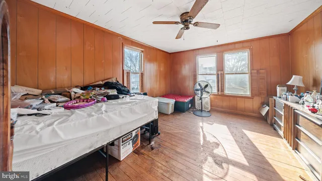 a bedroom with bed and a window