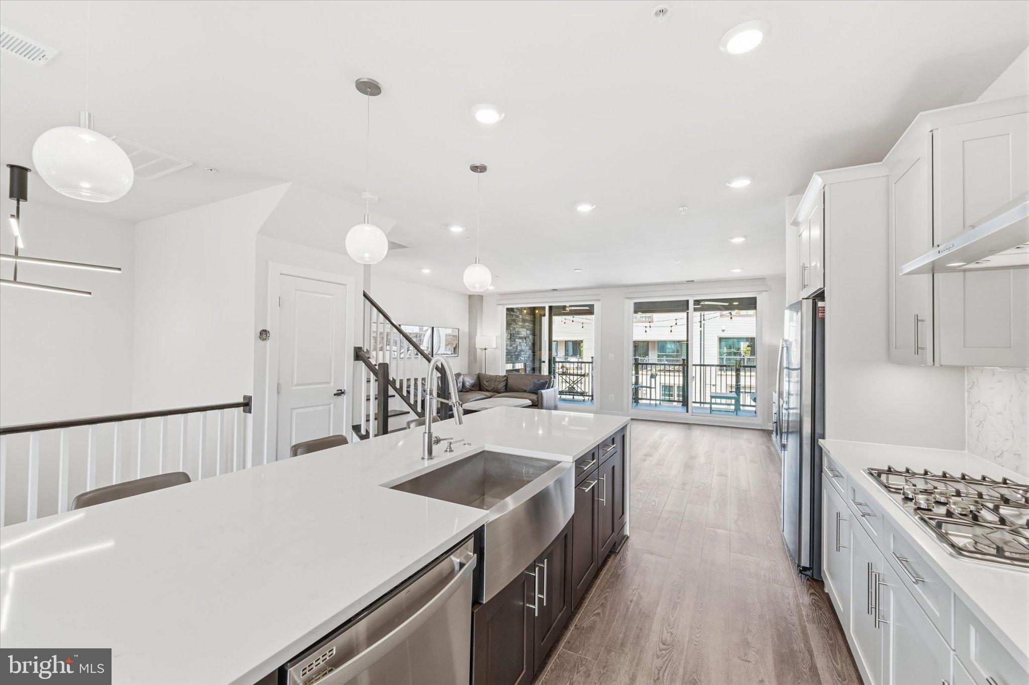 12915 Sunrise Ridge Alley, Unit 74 Herndon, VA 20171 - Photo 13 of 48 a large white kitchen with a large window