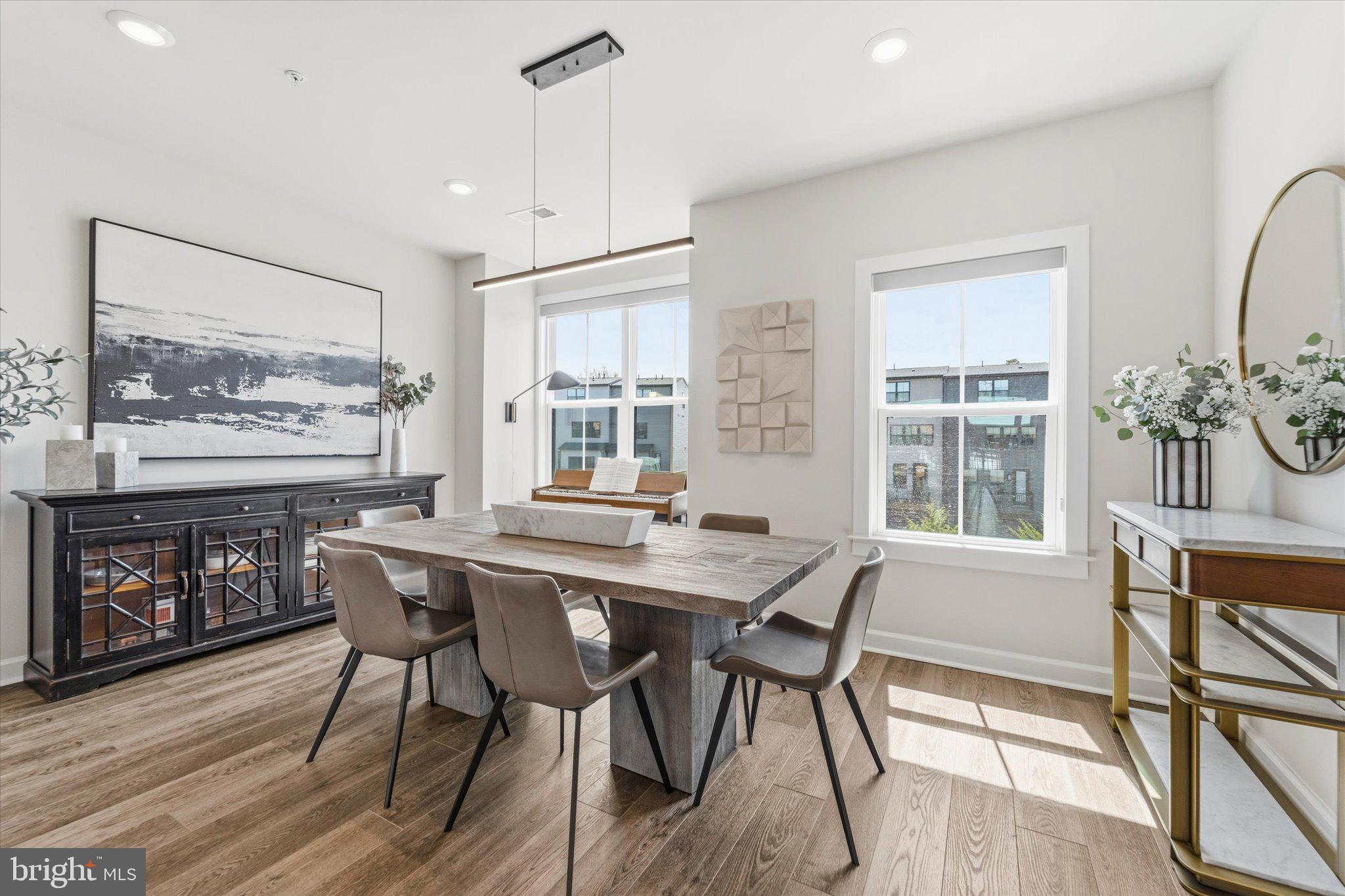 12915 Sunrise Ridge Alley, Unit 74 Herndon, VA 20171 - Photo 14 of 48 a view of a dining room with furniture window and wooden floor