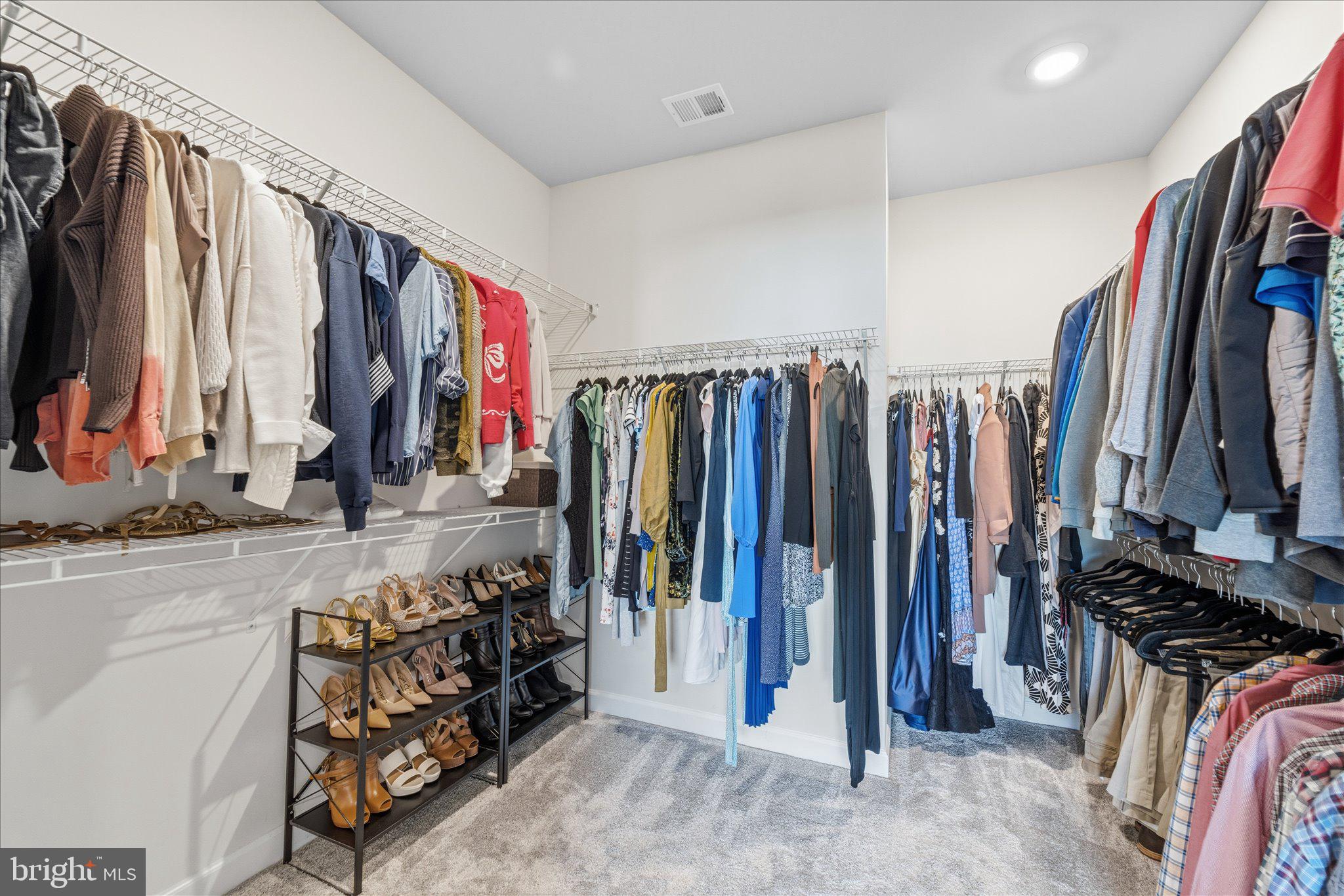 12915 Sunrise Ridge Alley, Unit 74 Herndon, VA 20171 - Photo 26 of 48 a view of walk in closet with clothes